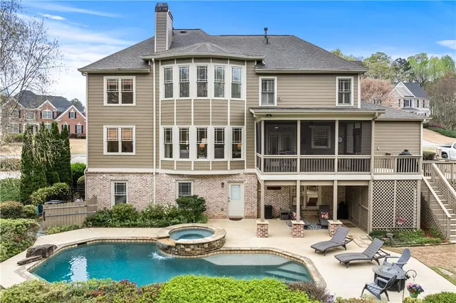 a front view of a house with swimming pool