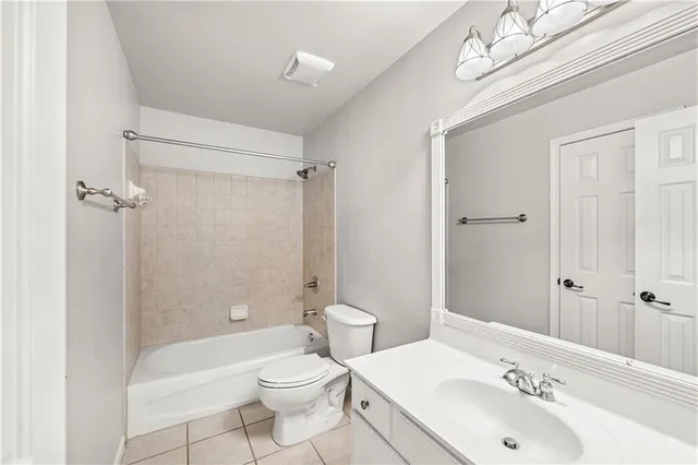 a bathroom with a double vanity sink mirror and