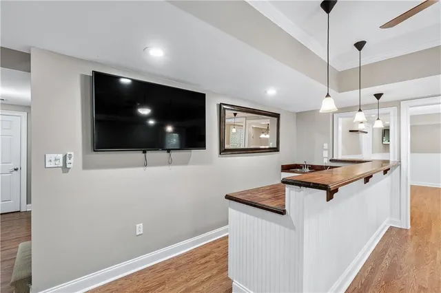 a bathroom with a sink vanity granite tub and shower