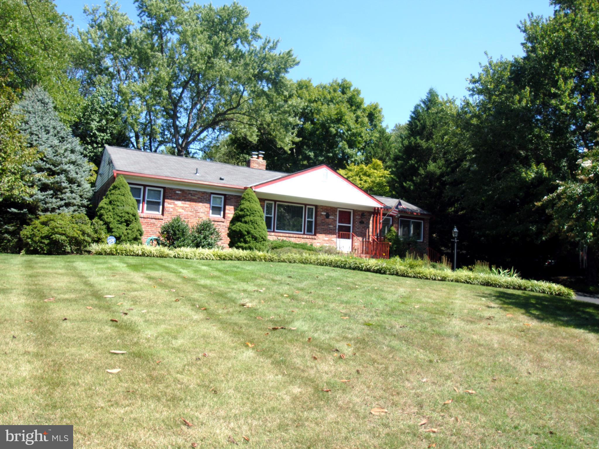 7921 Bainbridge Road Alexandria, VA 22308 - Photo 1 of 30 a front view of a house with yard patio and green space