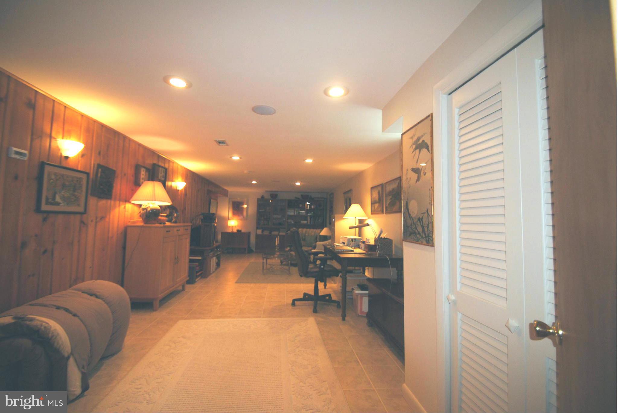 7921 Bainbridge Road Alexandria, VA 22308 - Photo 20 of 30 a view of a lobby with a couch and chairs