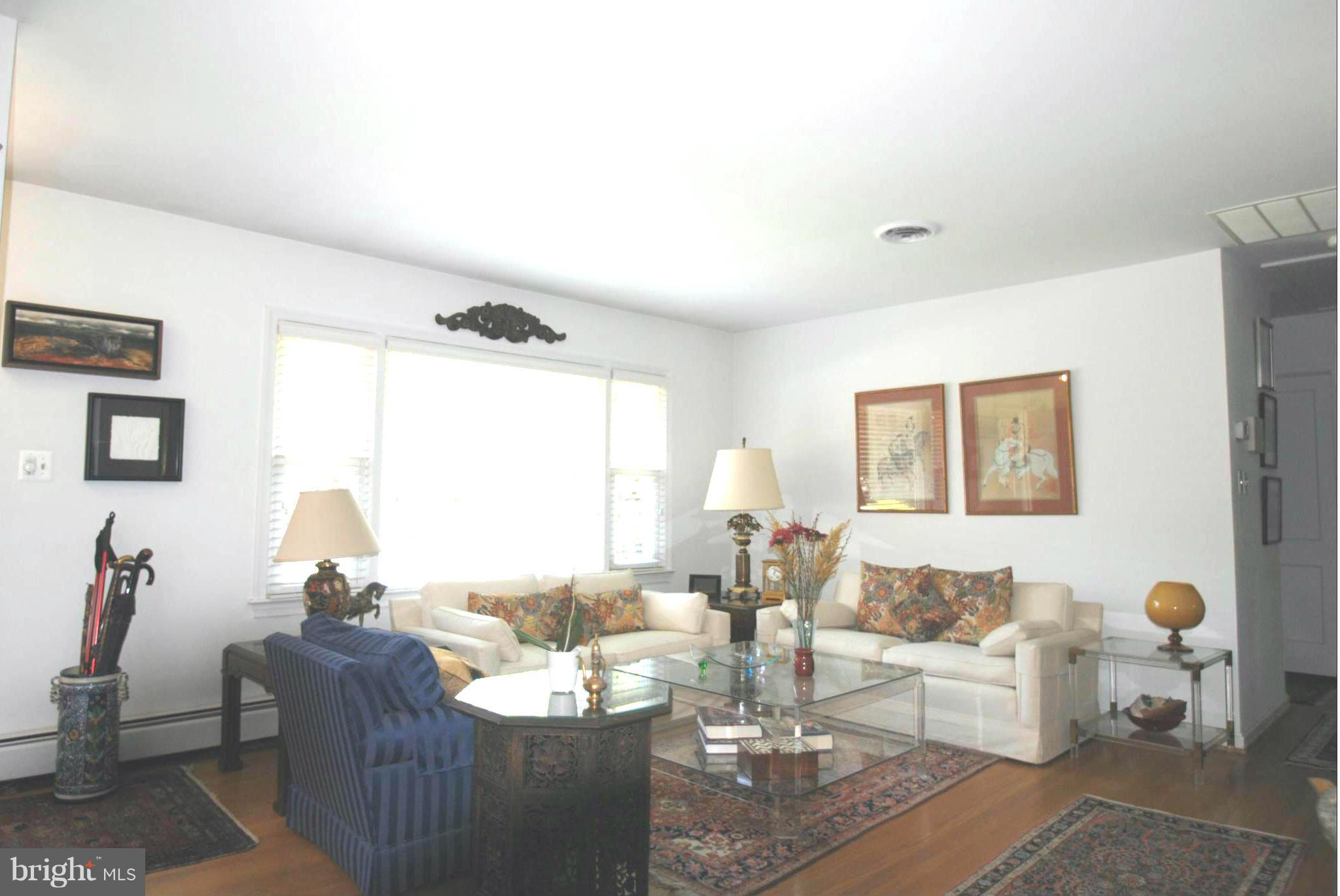 7921 Bainbridge Road Alexandria, VA 22308 - Photo 3 of 30 a living room with furniture and wooden floor