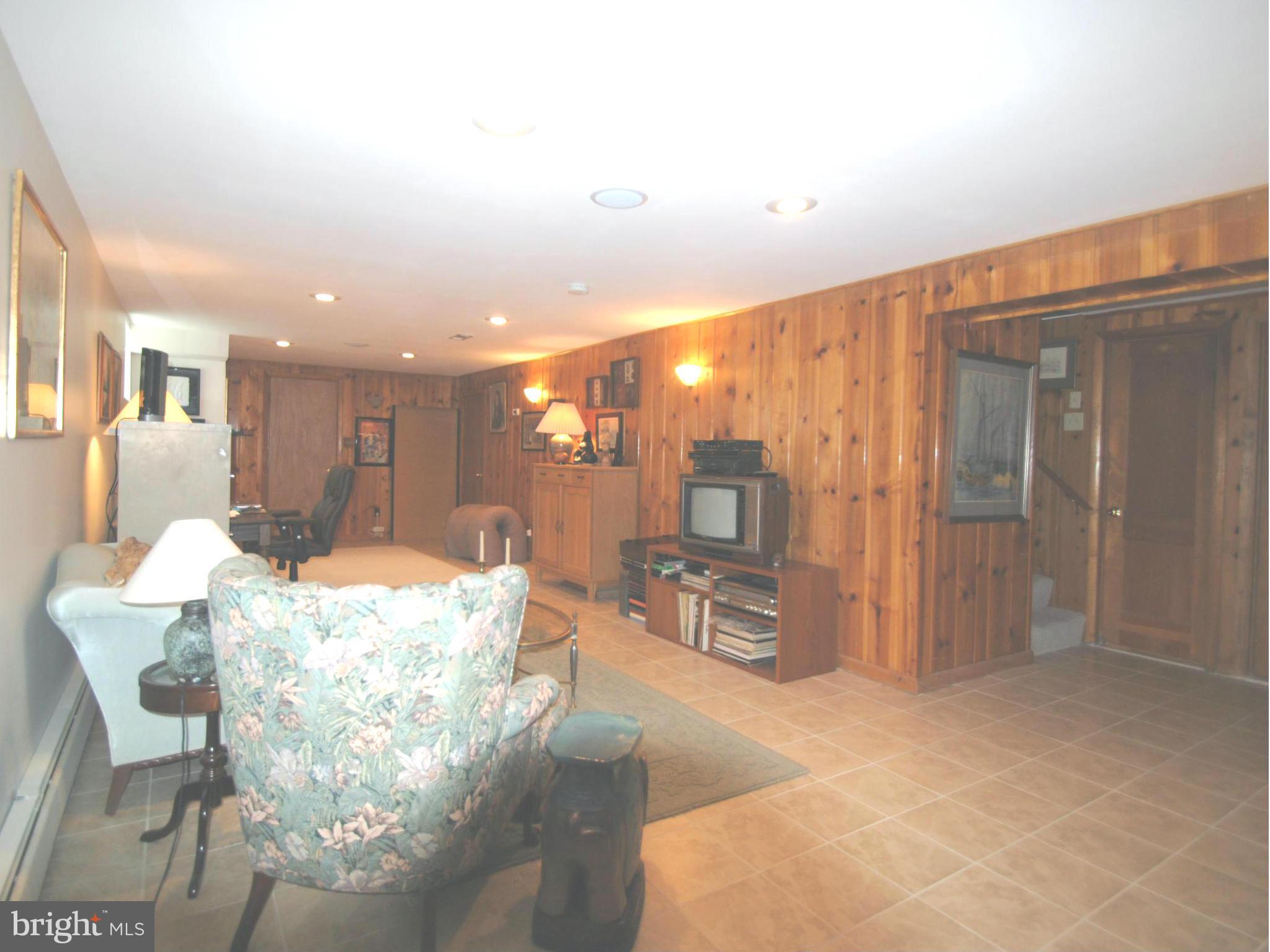 7921 Bainbridge Road Alexandria, VA 22308 - Photo 21 of 30 a dining room with furniture and a kitchen view