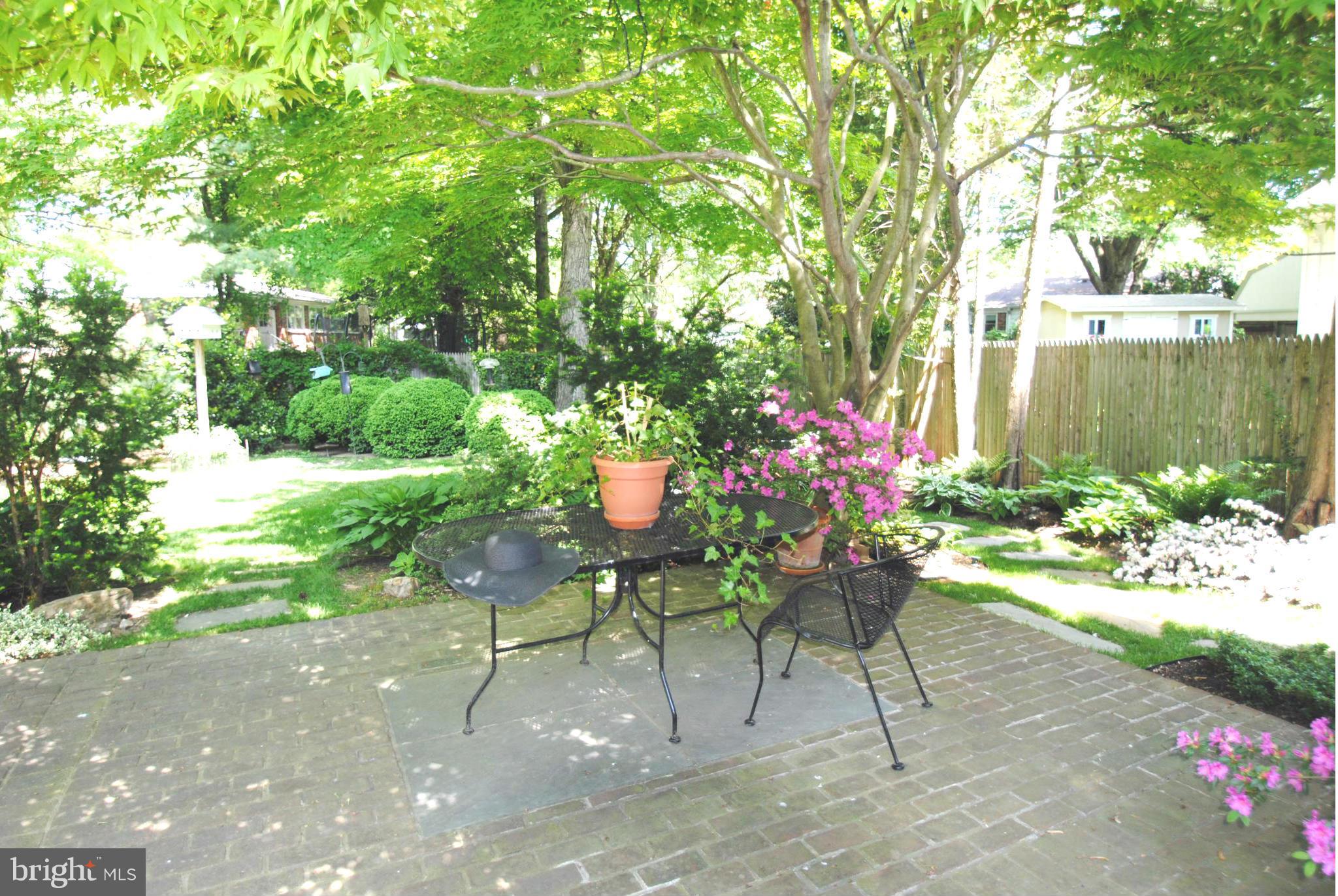 7921 Bainbridge Road Alexandria, VA 22308 - Photo 27 of 30 a view of a chairs and table in a garden