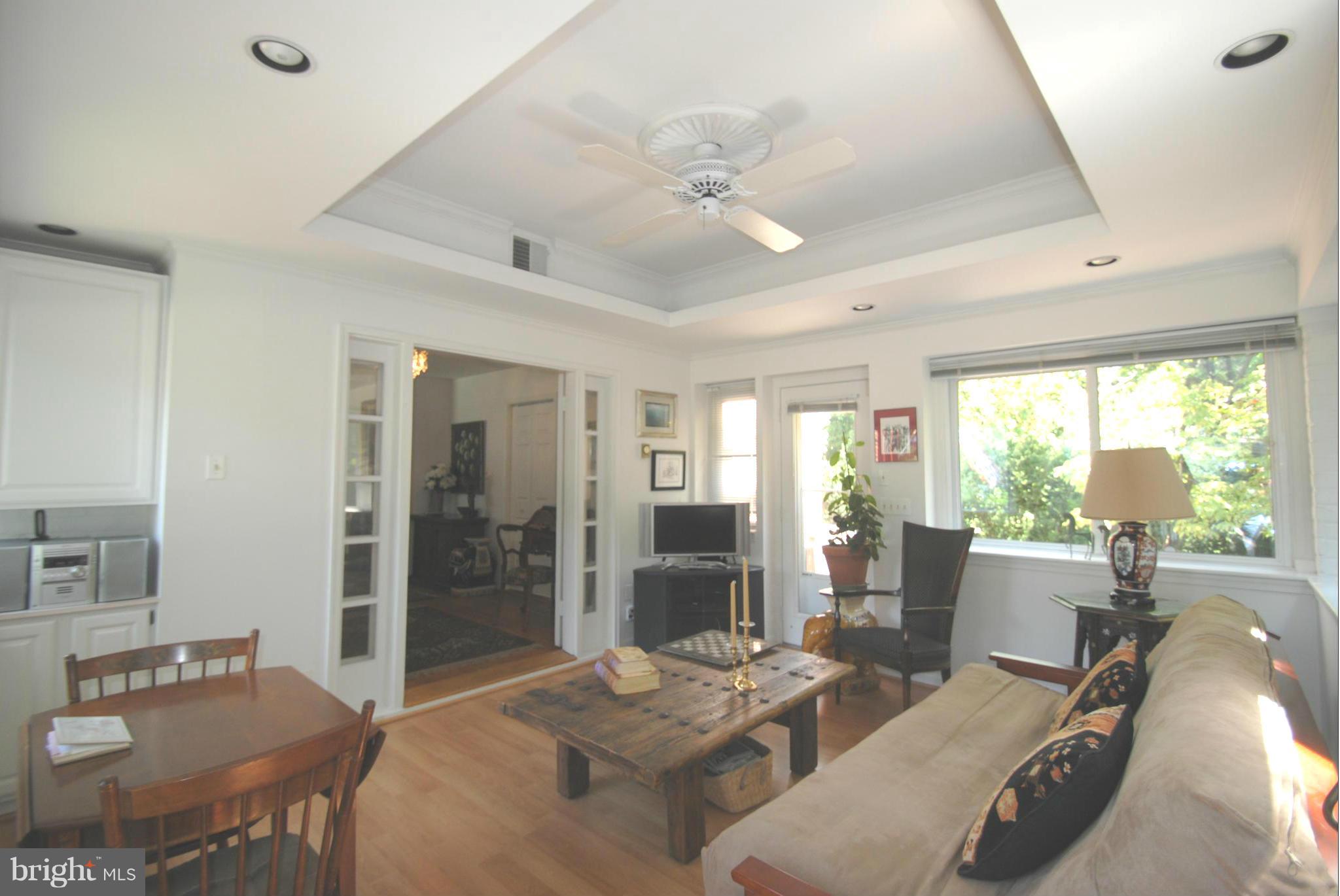 7921 Bainbridge Road Alexandria, VA 22308 - Photo 6 of 30 a living room with furniture and a large window