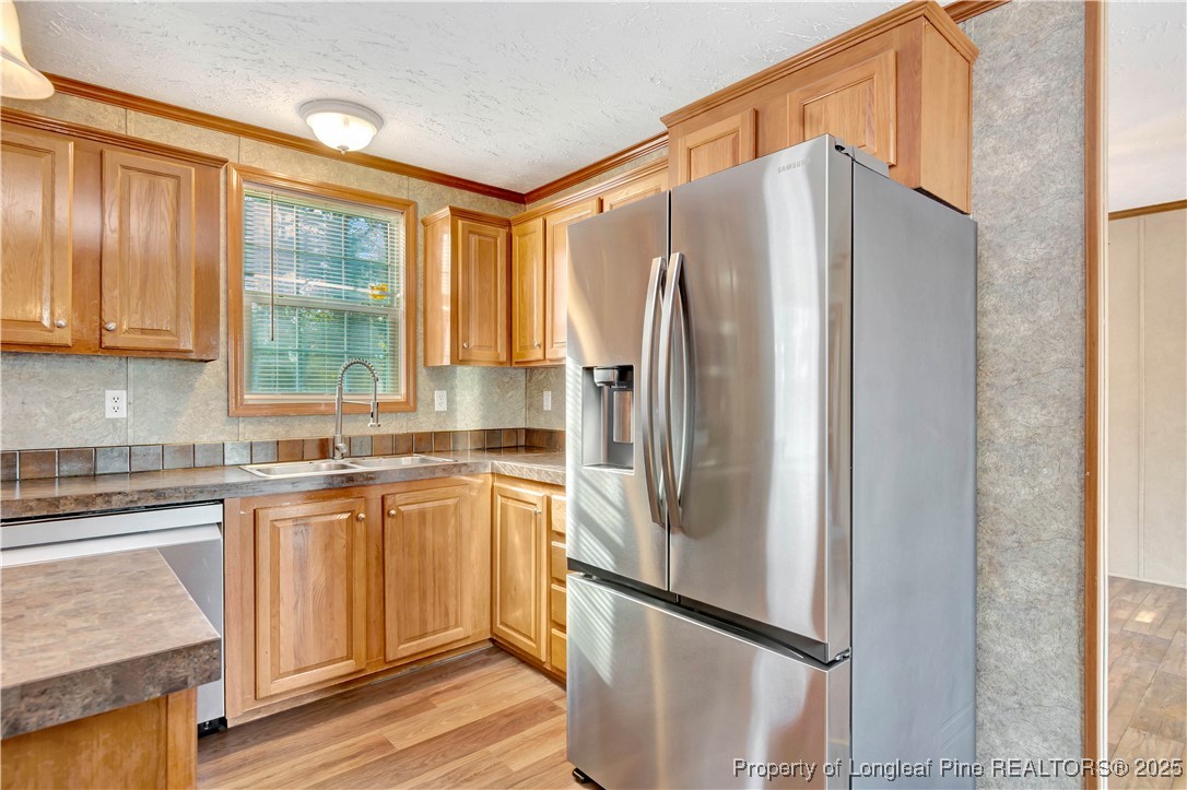 193 Fork Pine Road Lumberton, NC 28358 - Photo 13 of 40 a kitchen with stainless steel appliances a refrigerator sink and cabinets