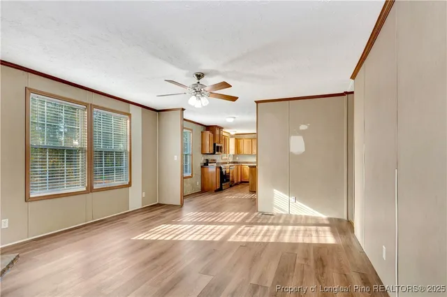 a view of a livingroom with furniture and an entryway