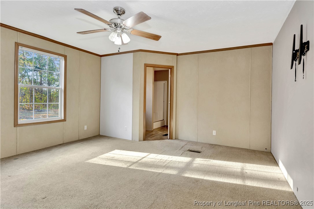 193 Fork Pine Road Lumberton, NC 28358 - Photo 18 of 40 a view of a livingroom with a ceiling fan and window