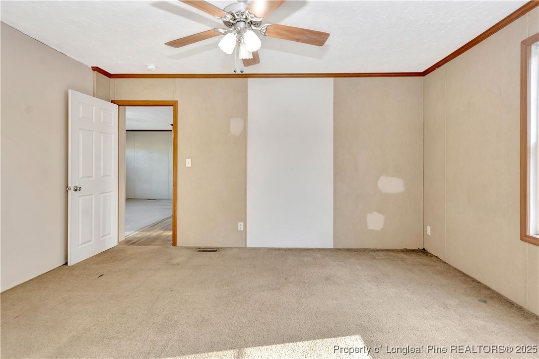 193 Fork Pine Road Lumberton, NC 28358 - Photo 19 of 40 an empty room with a ceiling fan and a window