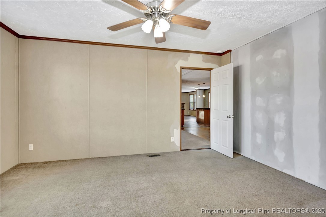 193 Fork Pine Road Lumberton, NC 28358 - Photo 24 of 40 a view of an empty room and chandelier fan