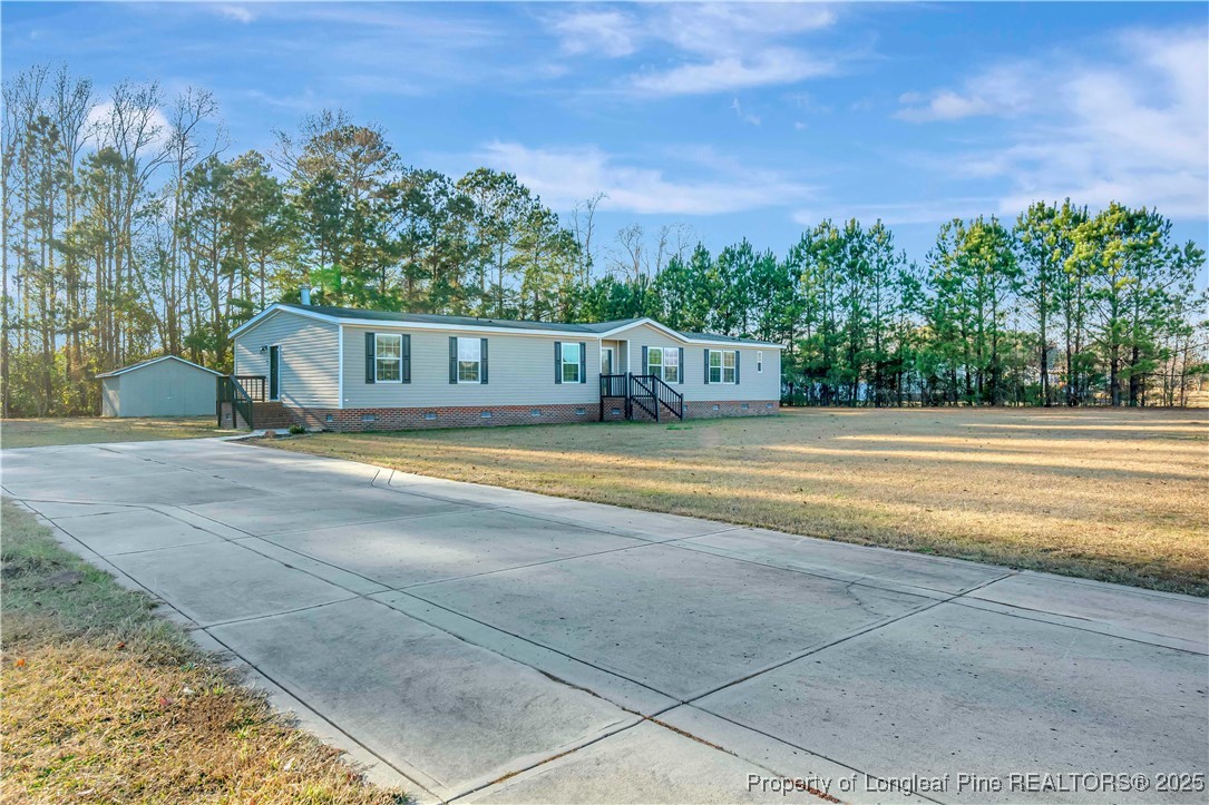 193 Fork Pine Road Lumberton, NC 28358 - Photo 3 of 40 a view of a house with a yard