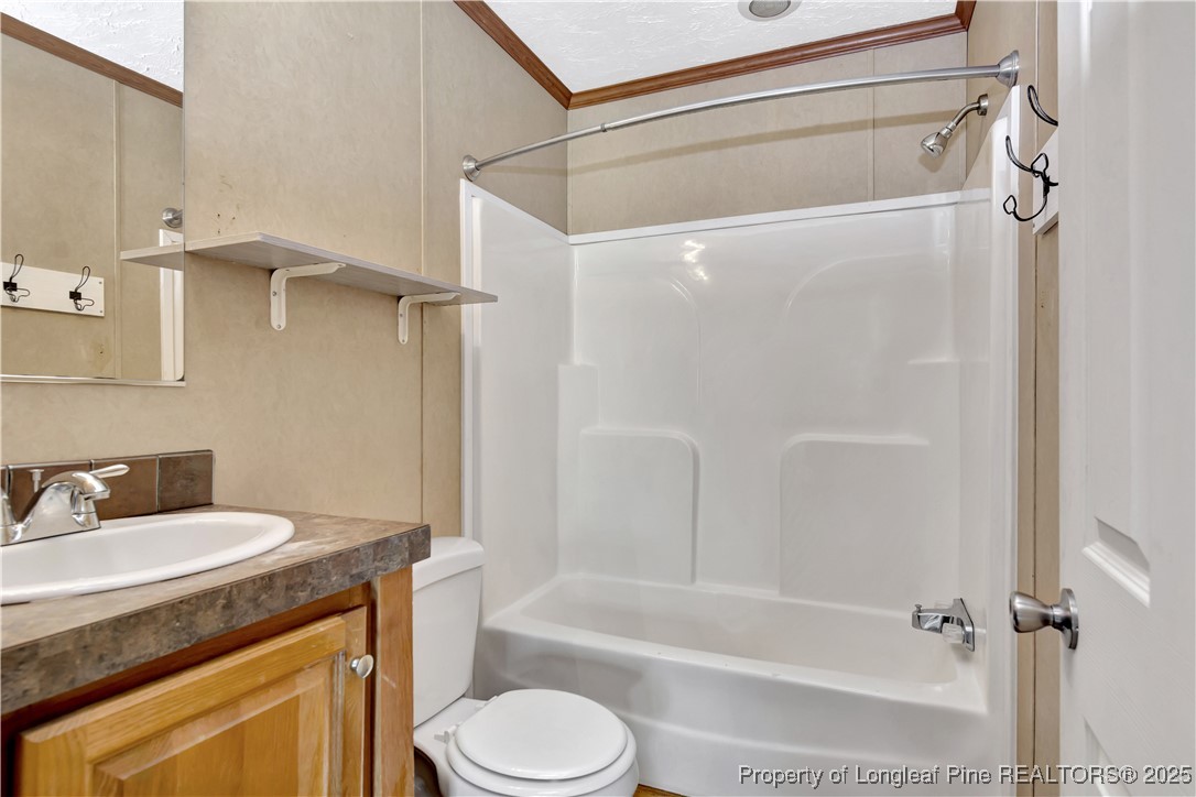 193 Fork Pine Road Lumberton, NC 28358 - Photo 33 of 40 a bathroom with a granite countertop sink toilet and shower