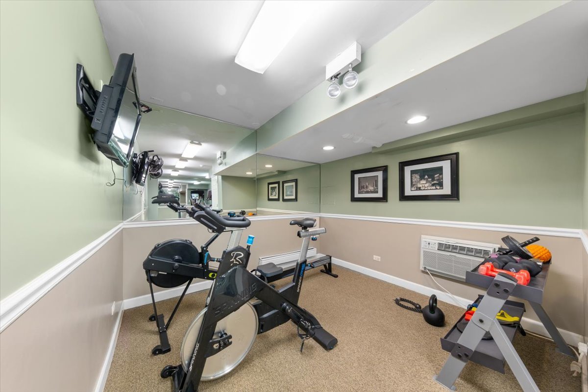 3900 North Pine Grove Avenue, Unit 910 Chicago, IL 60613 - Photo 14 of 18 a view of a room with gym equipment
