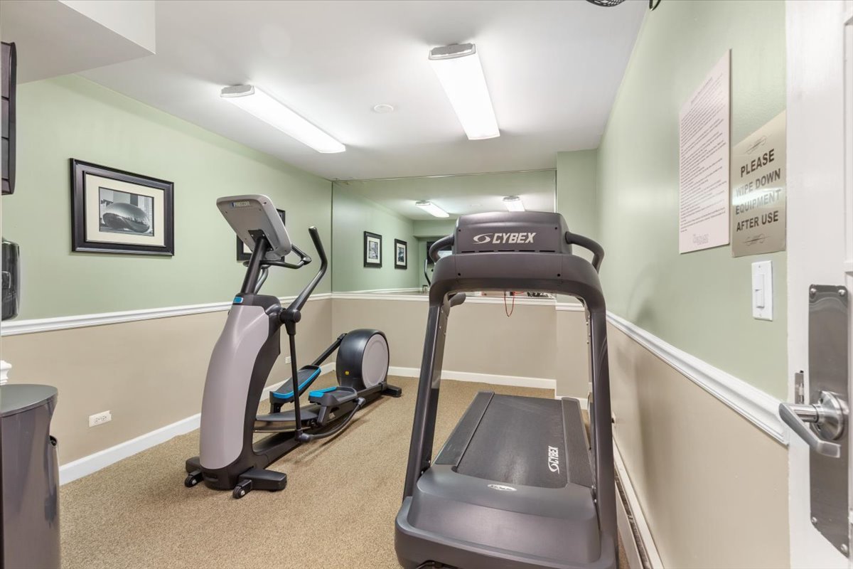 3900 North Pine Grove Avenue, Unit 910 Chicago, IL 60613 - Photo 15 of 18 a view of a room with gym equipment