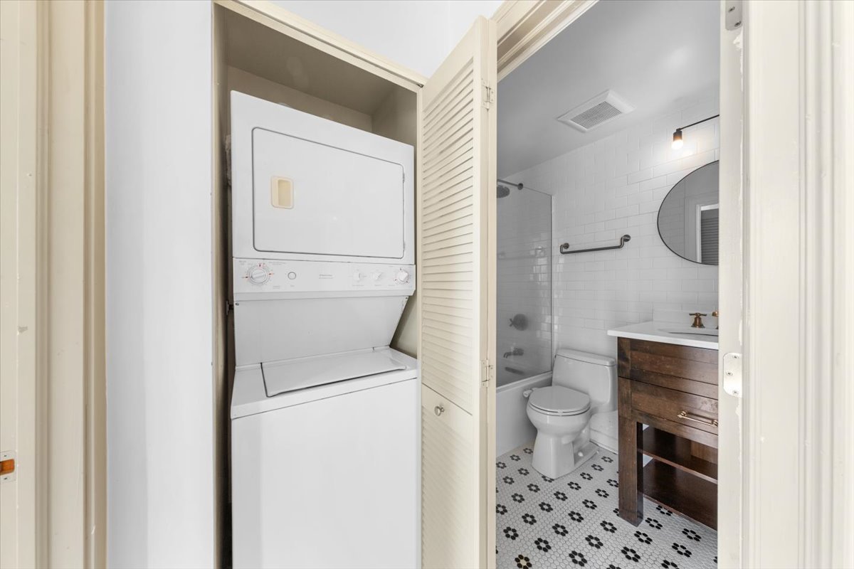 3900 North Pine Grove Avenue, Unit 910 Chicago, IL 60613 - Photo 8 of 18 a bathroom with a toilet and a shower