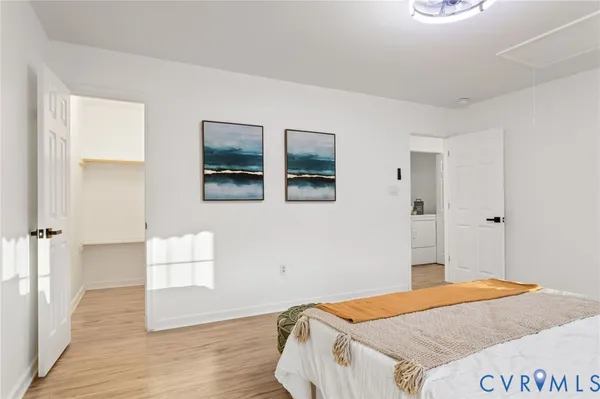 a bathroom with a granite countertop toilet sink and mirror