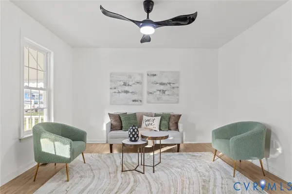 a living room with furniture and a window