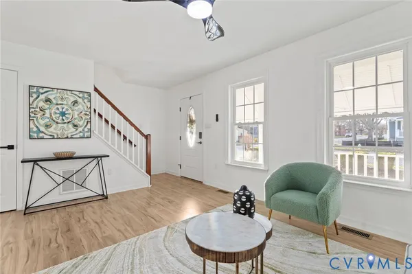a living room with furniture and a window