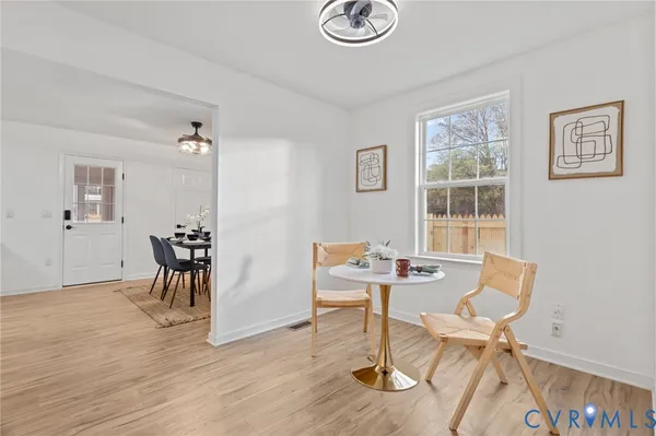 a work room with furniture and wooden floor