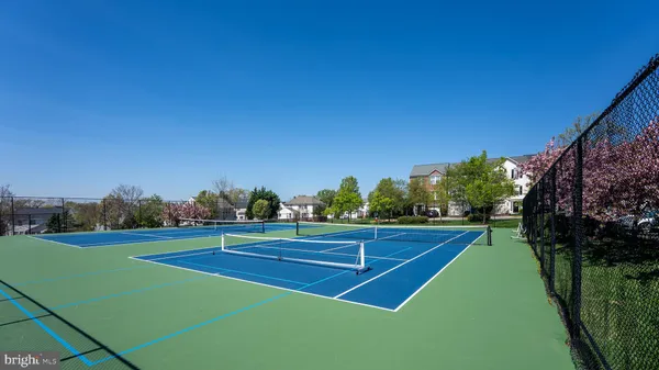 a view of an outdoor space and tennis court