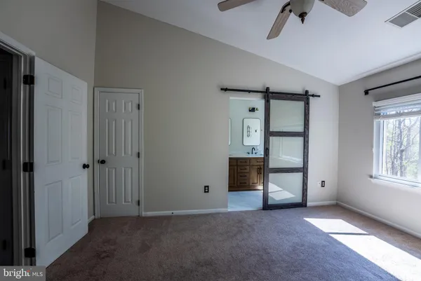 a view of an empty room with a window