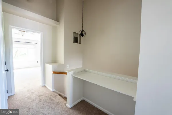 a view of storage and utility room with closet