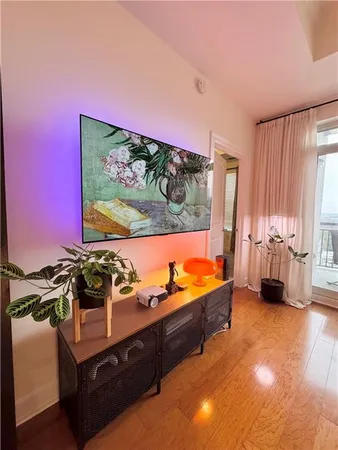 a kitchen with stainless steel appliances a dining table chairs stove and kitchen view