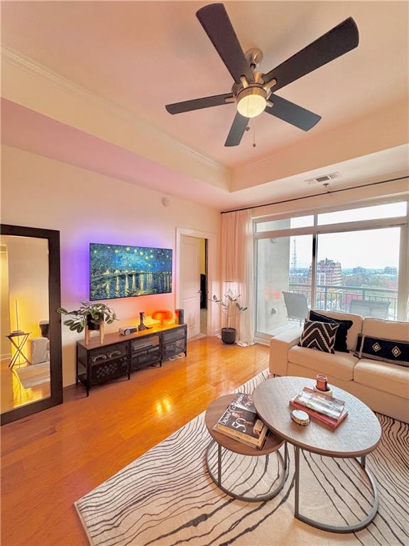 325 East Paces Ferry Road Northeast, Unit 1701 Atlanta, GA 30305 - Photo 20 of 46 a living room with furniture and a large window