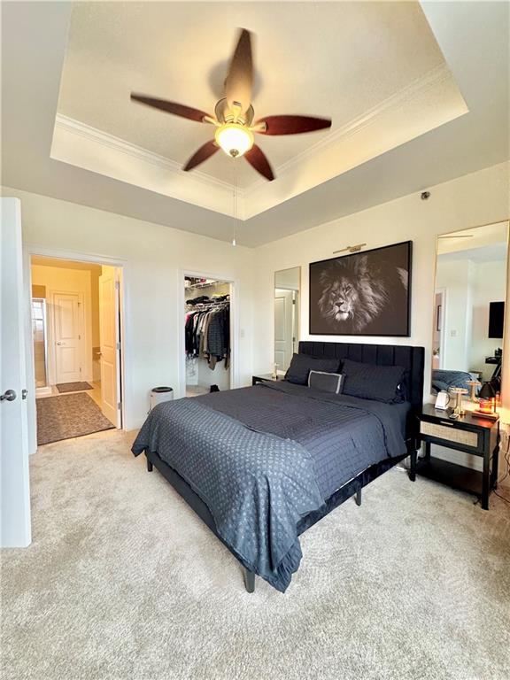 325 East Paces Ferry Road Northeast, Unit 1701 Atlanta, GA 30305 - Photo 21 of 46 a bedroom with a large bed and a chandelier