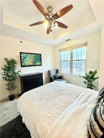 a kitchen with granite countertop a stove a sink and a microwave