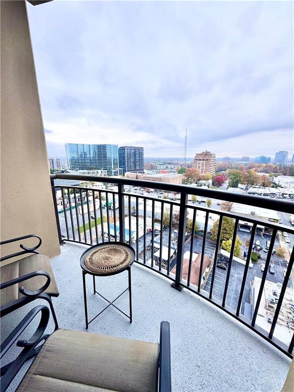 325 East Paces Ferry Road Northeast, Unit 1701 Atlanta, GA 30305 - Photo 34 of 46 a view of a chairs and table in the balcony