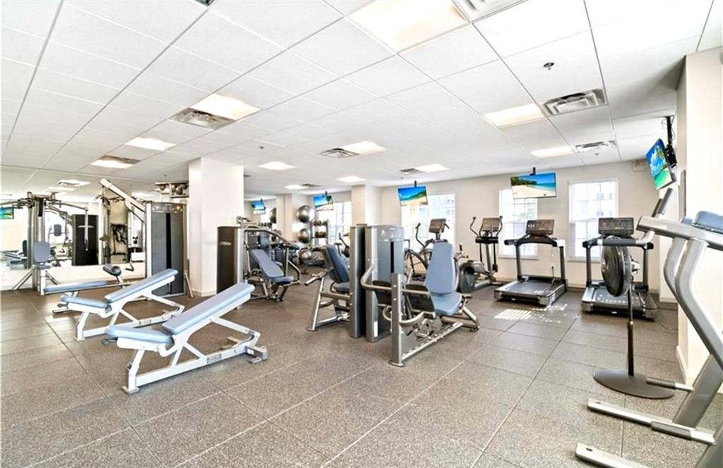 325 East Paces Ferry Road Northeast, Unit 1701 Atlanta, GA 30305 - Photo 44 of 46 a view of a room with gym equipment