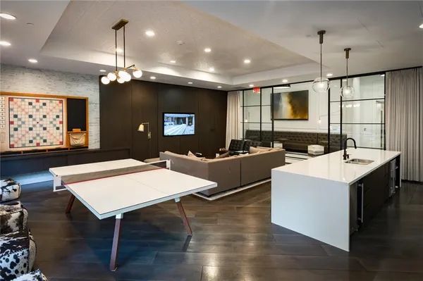 a large kitchen with a table and chairs in it