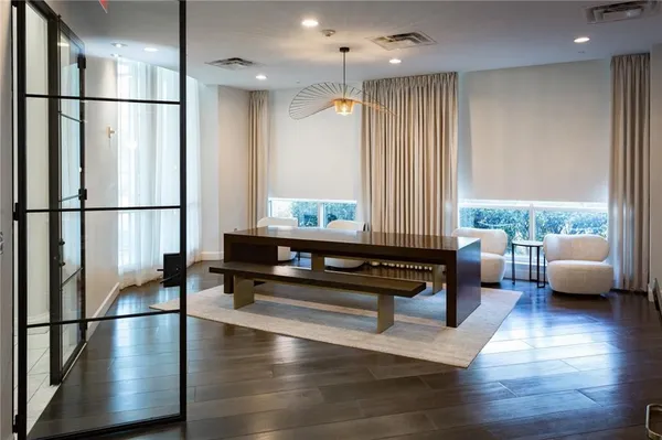 a view of an entryway with a table and chairs
