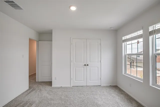 an empty room with windows