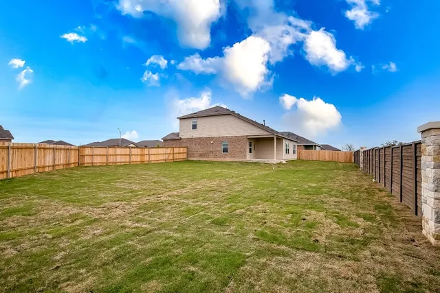 a view of a house with a big yard