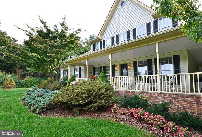 2415 Engle Road Fallston, MD 21047 - Photo 2 of 29 a front view of a house with a garden