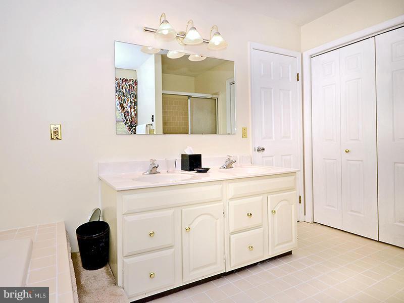 2415 Engle Road Fallston, MD 21047 - Photo 19 of 29 a bathroom with a double vanity sink mirror and