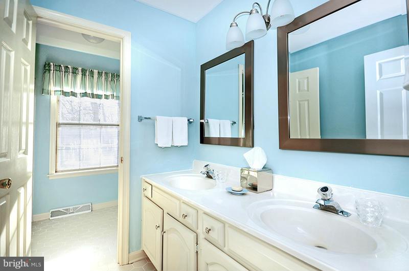 2415 Engle Road Fallston, MD 21047 - Photo 22 of 29 a bathroom with a sink and a mirror