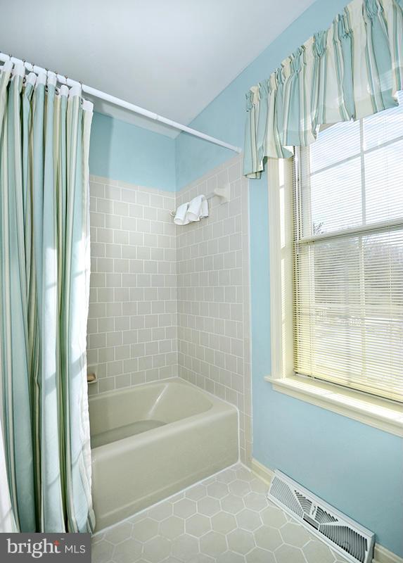 2415 Engle Road Fallston, MD 21047 - Photo 23 of 29 a bathroom with a bathtub and a shower