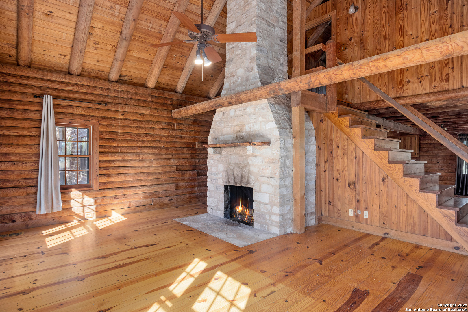 387 Schmidtzinsky Road Fredericksburg, TX 78624 - Photo 3 of 37 a view of a fireplace with wooden floor
