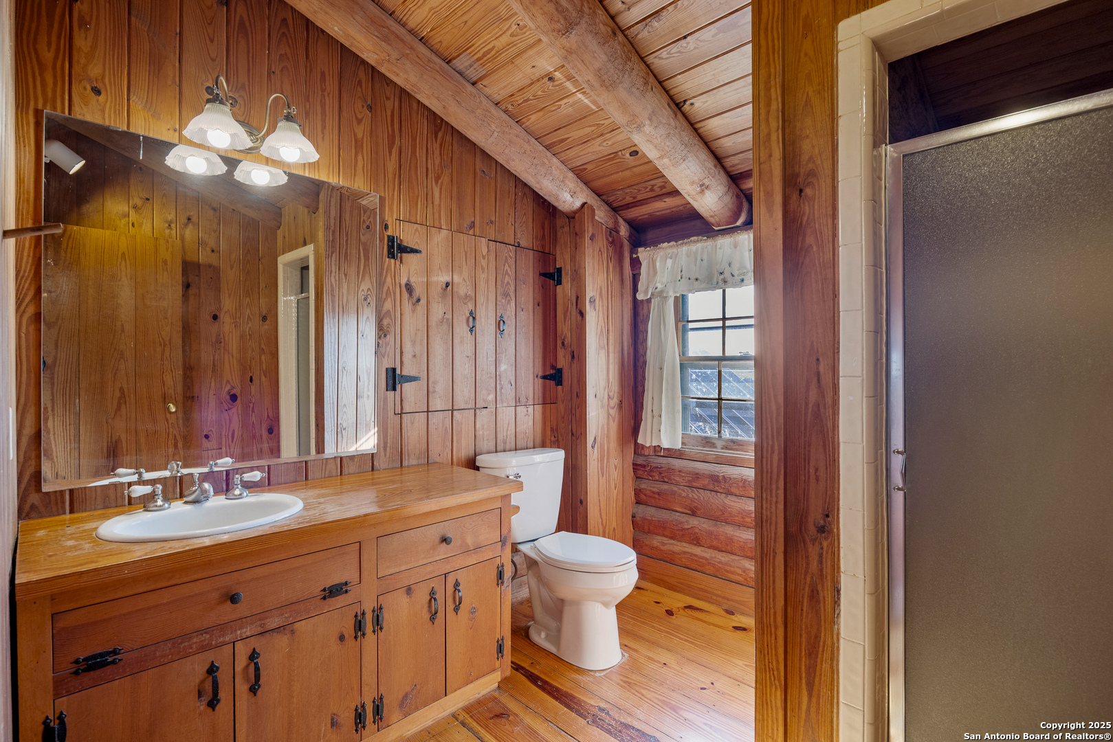 387 Schmidtzinsky Road Fredericksburg, TX 78624 - Photo 6 of 37 a bathroom with a double vanity sink mirror and toilet