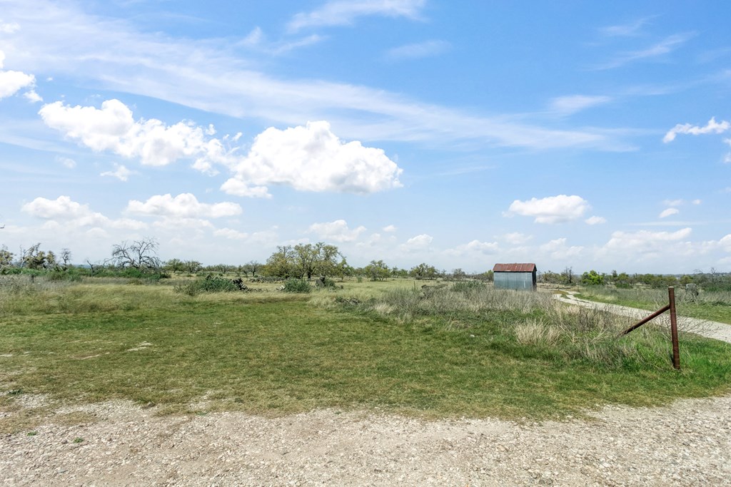 3527 Old Harper Road Fredericksburg, TX 78624 - Photo 36 of 43 a view of a lake and a yard