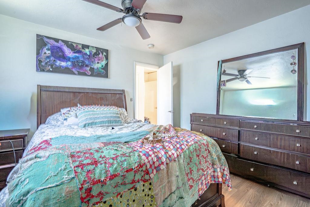 470 Riverside Avenue Chester, CA 96020 - Photo 19 of 25 a bedroom with a bed and a flat screen tv