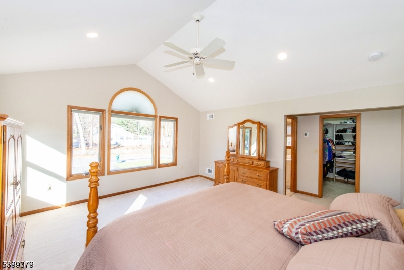 21 Dolly Road Parsippany, NJ 07054 - Photo 17 of 35 a bedroom with a bed and a large window with the outer view