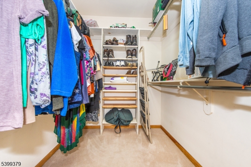 21 Dolly Road Parsippany, NJ 07054 - Photo 20 of 35 a view of walk in closet with clothes and shoes