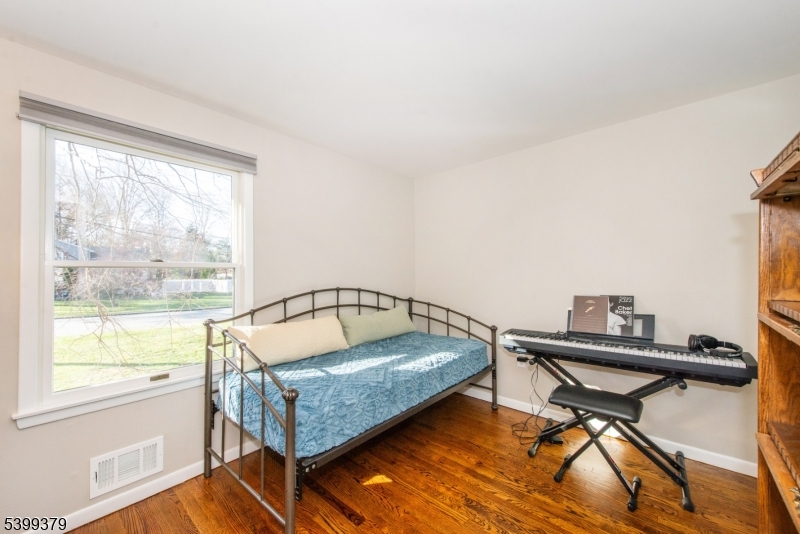 21 Dolly Road Parsippany, NJ 07054 - Photo 26 of 35 a living room with a couch a table and a window