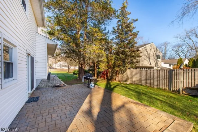 a view of a backyard with pathway