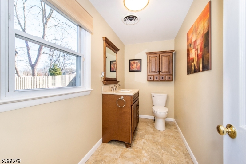 21 Dolly Road Parsippany, NJ 07054 - Photo 6 of 35 a bathroom with a sink and mirror with toilet