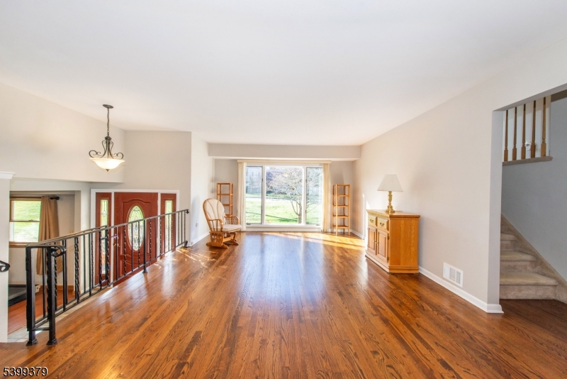 21 Dolly Road Parsippany, NJ 07054 - Photo 7 of 35 a view of empty room with wooden floor and fan